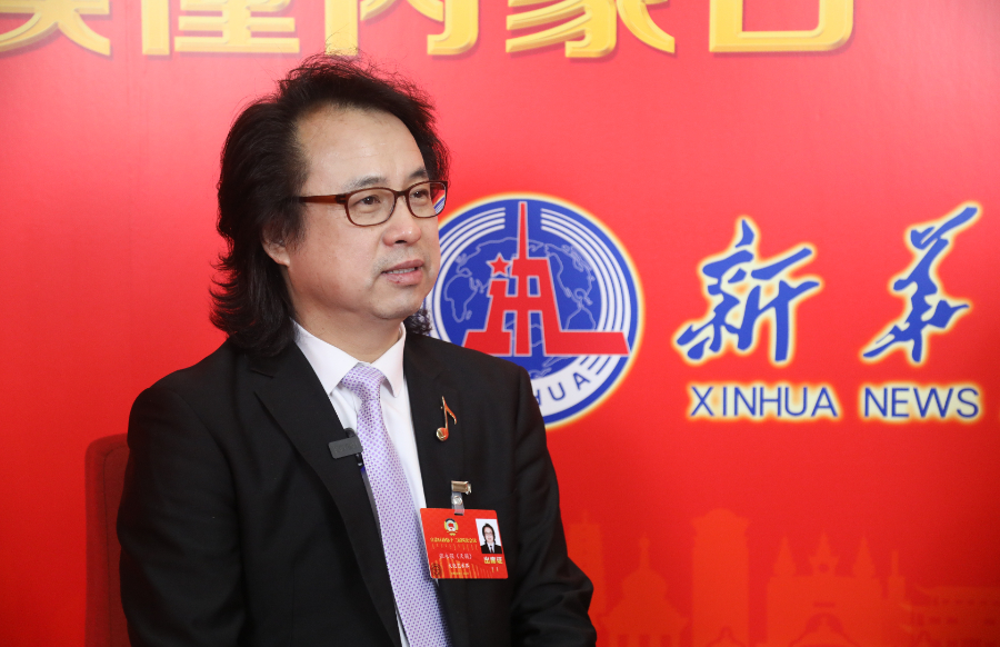 读懂内蒙古·新华访谈丨政协委员天骏：以歌为媒传民声
